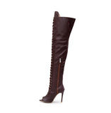 Brown thigh-high boots with convenient side zipper, perfect for various occasions.